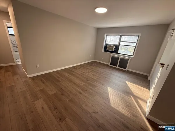 wooden floor in a hall with an entryway