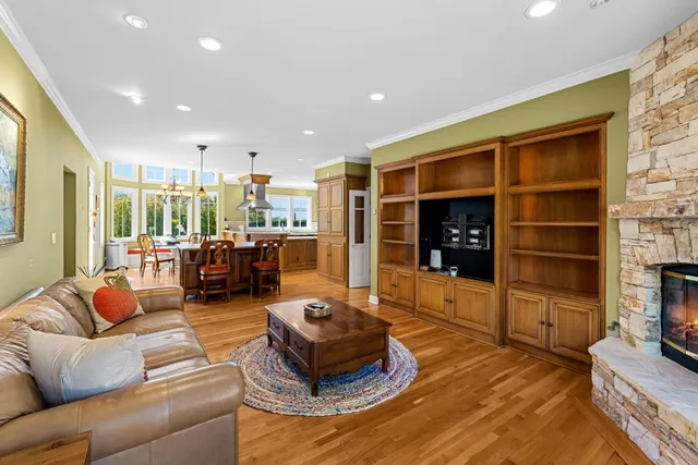 a living room with furniture window and fireplace