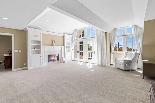a balcony with wooden floor and outdoor space