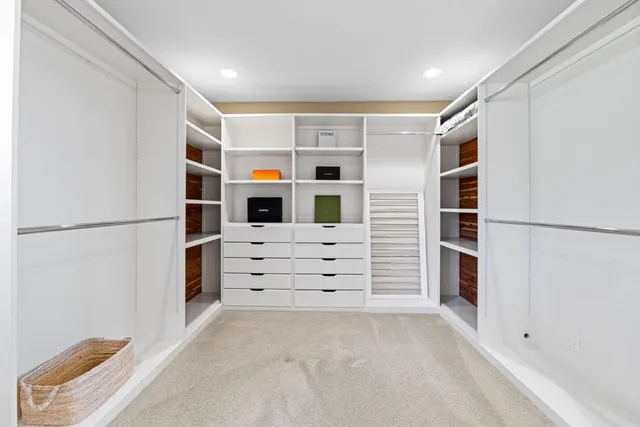 a spacious bathroom with a double vanity sink and a mirror