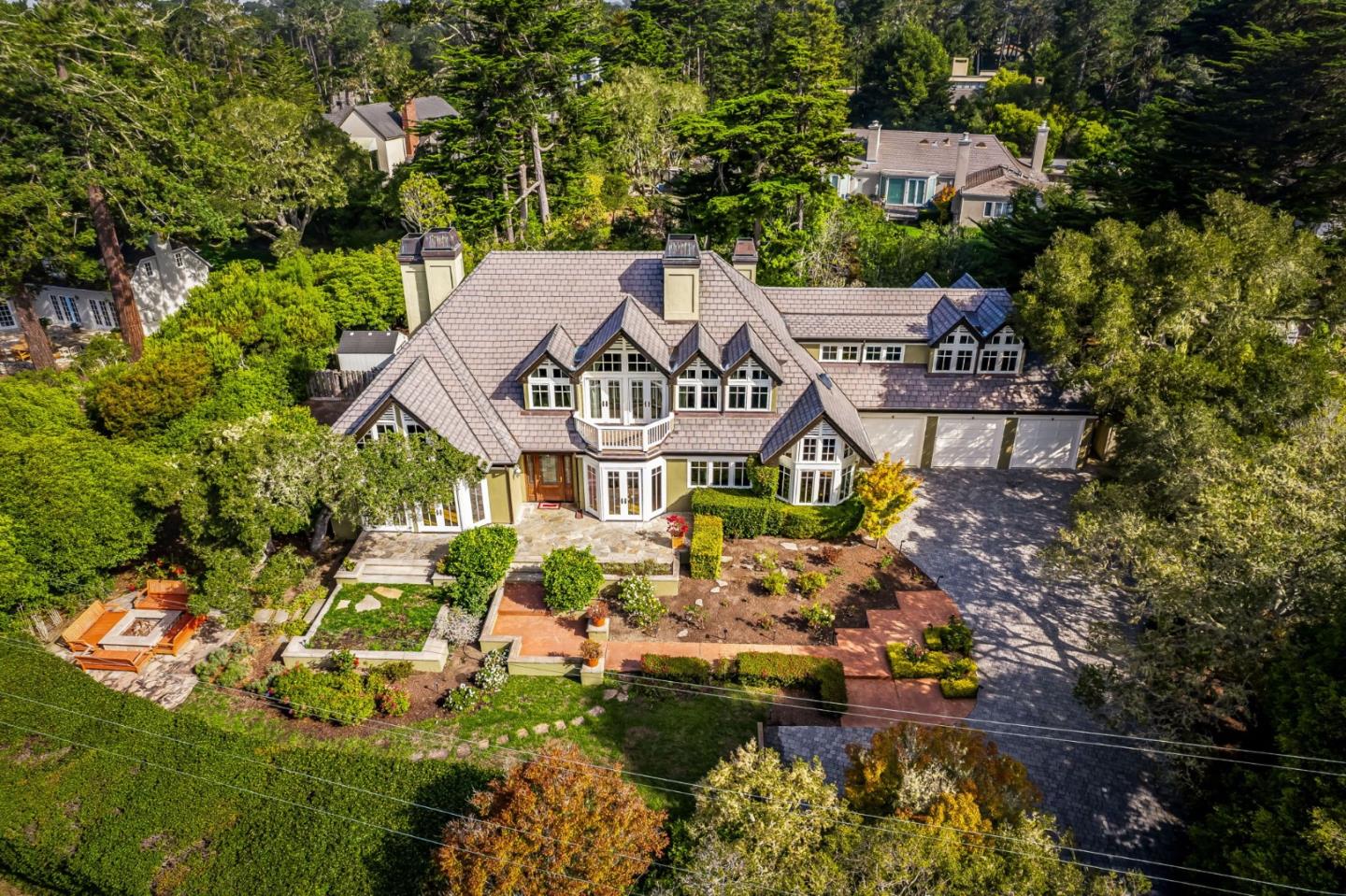 3937 Ronda Road Pebble Beach, CA 93953 - Photo 3 of 25 an aerial view of a house with a garden