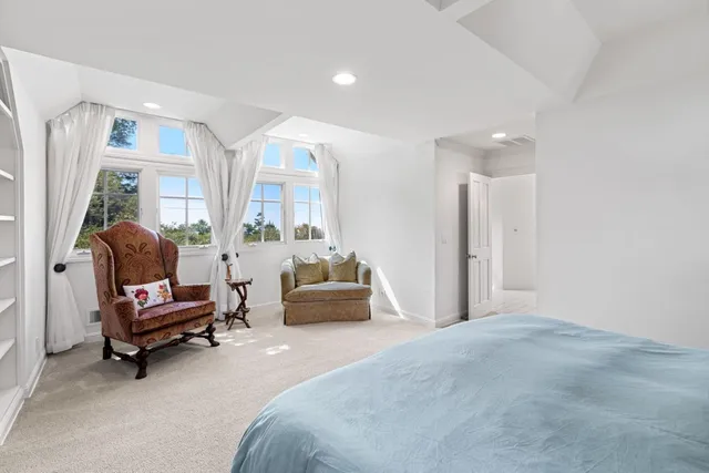 a spacious bathroom with a shower sink and mirror