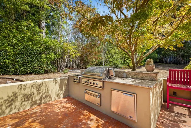 an aerial view of a house with a yard and fountain