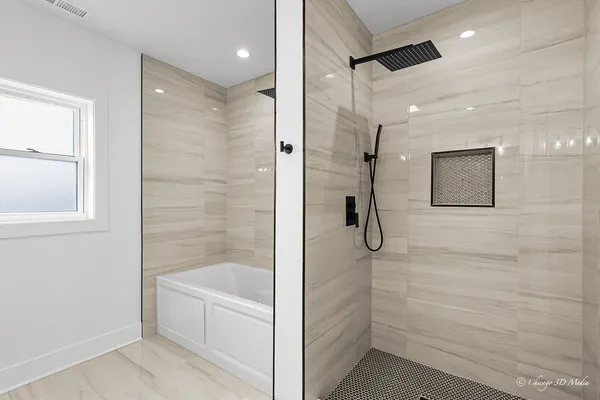 a bathroom with a bathtub and a shower