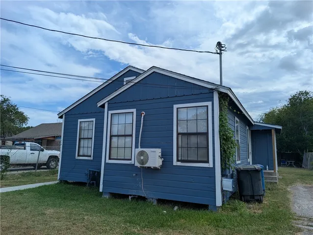 a front view of a house with a wooden fence