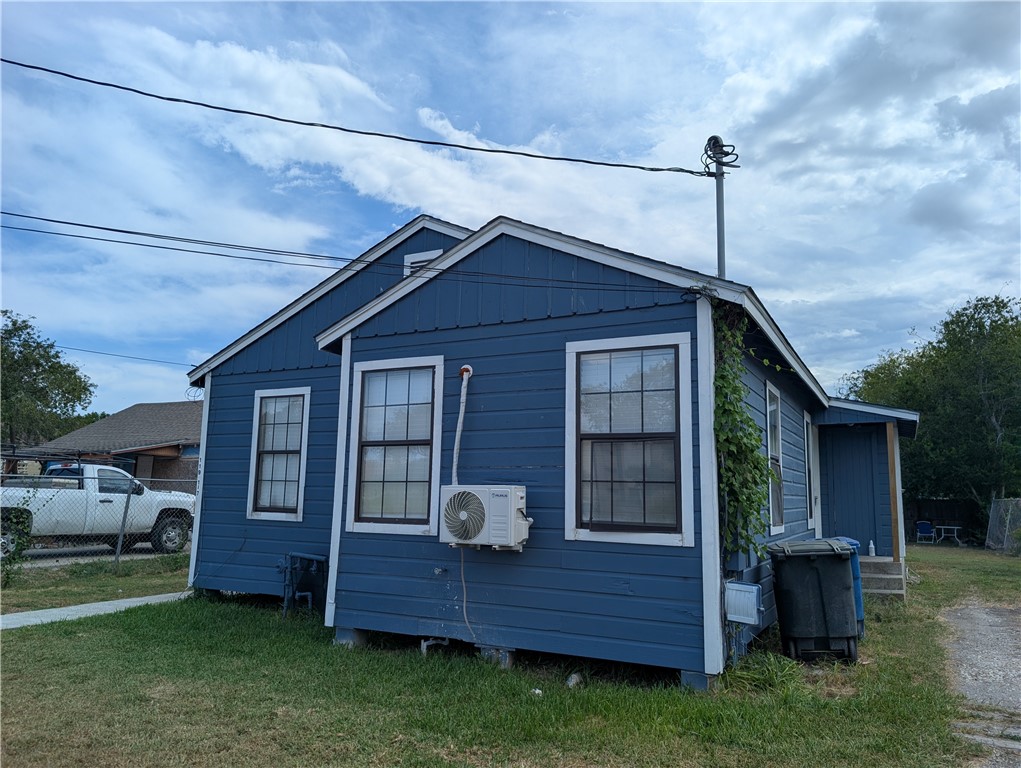 a front view of a house with a wooden fence