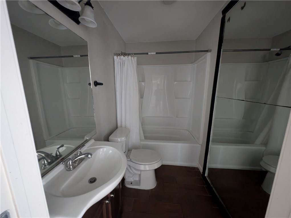 117 Edwards Street Corpus Christi, TX 78404 - Photo 5 of 6 a bathroom with a sink a toilet and shower