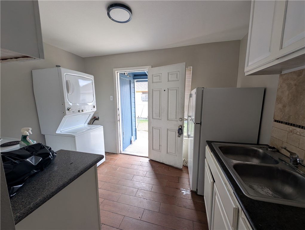 117 Edwards Street Corpus Christi, TX 78404 - Photo 6 of 6 a kitchen with granite countertop a sink stove and refrigerator
