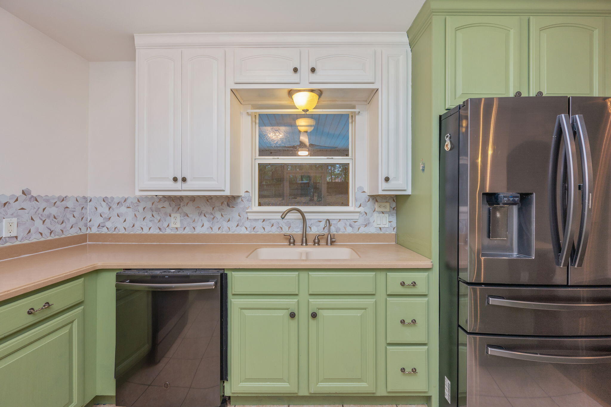 231 Seneca Trail Crestview, FL 32536 - Photo 12 of 39 a kitchen with cabinets and stainless steel appliances