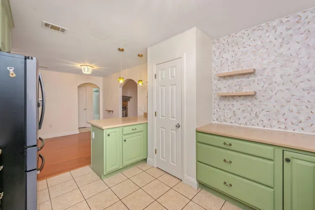 a spacious bathroom with a granite countertop sink mirror and shower