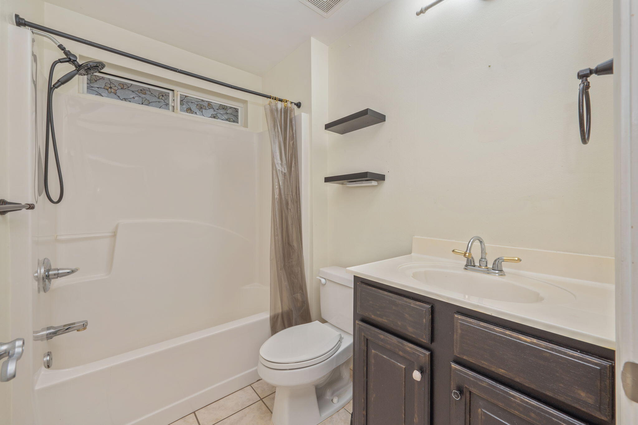 231 Seneca Trail Crestview, FL 32536 - Photo 28 of 39 a bathroom with a sink toilet and shower