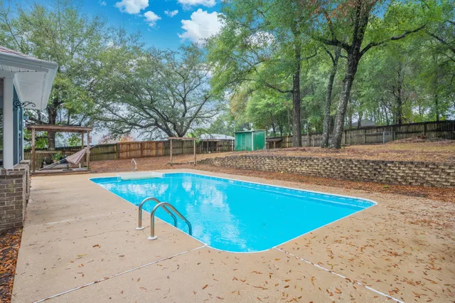 a view of a swimming pool with an outdoor space