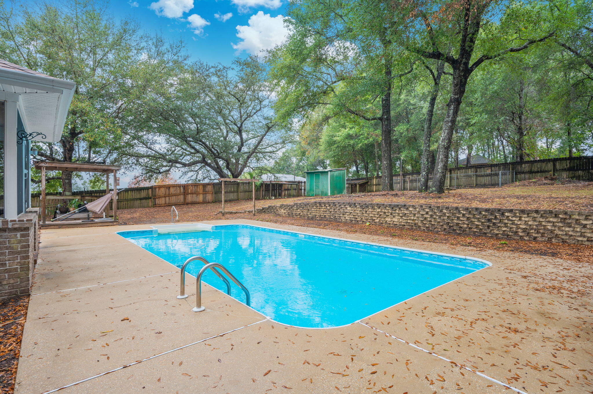 231 Seneca Trail Crestview, FL 32536 - Photo 34 of 39 a view of a swimming pool with an outdoor space