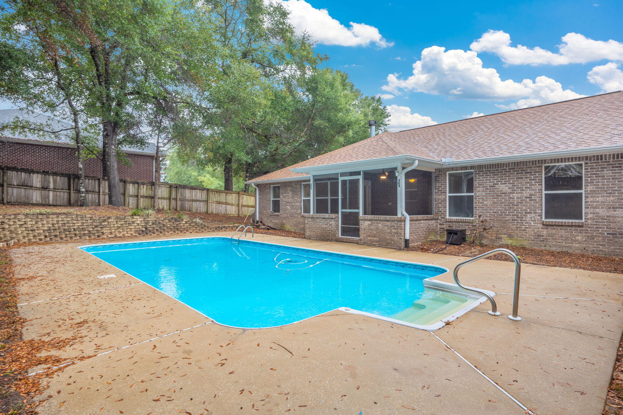 231 Seneca Trail Crestview, FL 32536 - Photo 35 of 39 a view of a house with swimming pool and sitting area