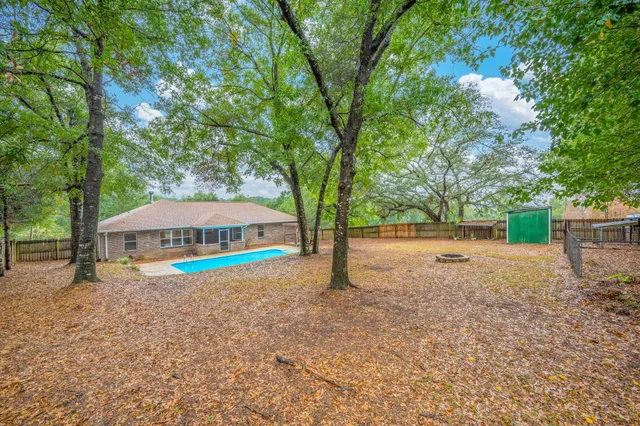 a house with trees in the background