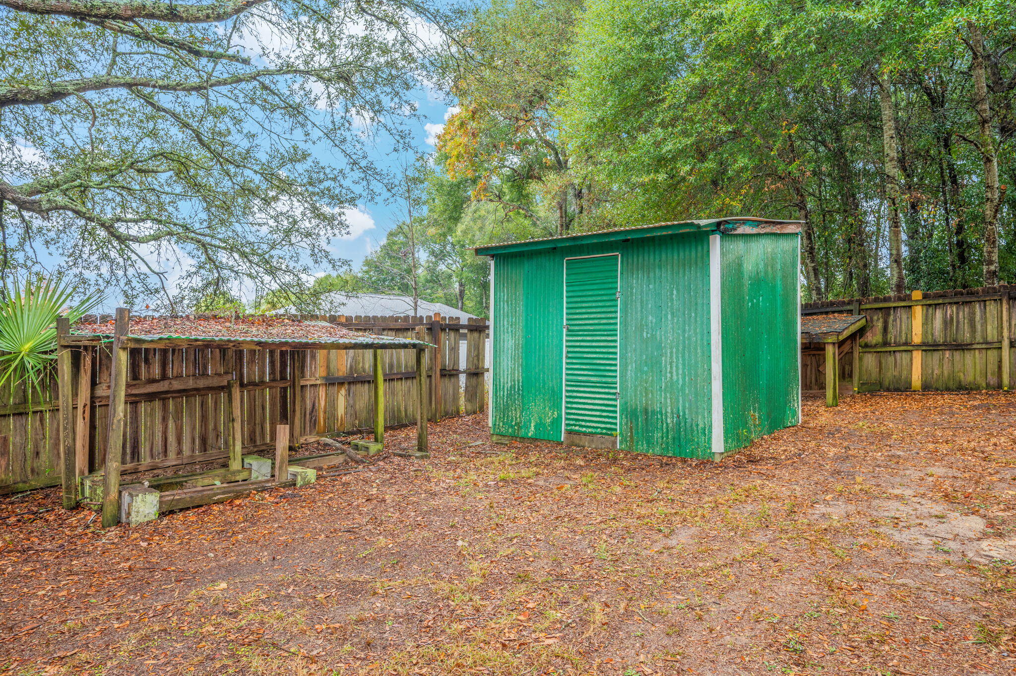231 Seneca Trail Crestview, FL 32536 - Photo 39 of 39 a view of a backyard with small cabin