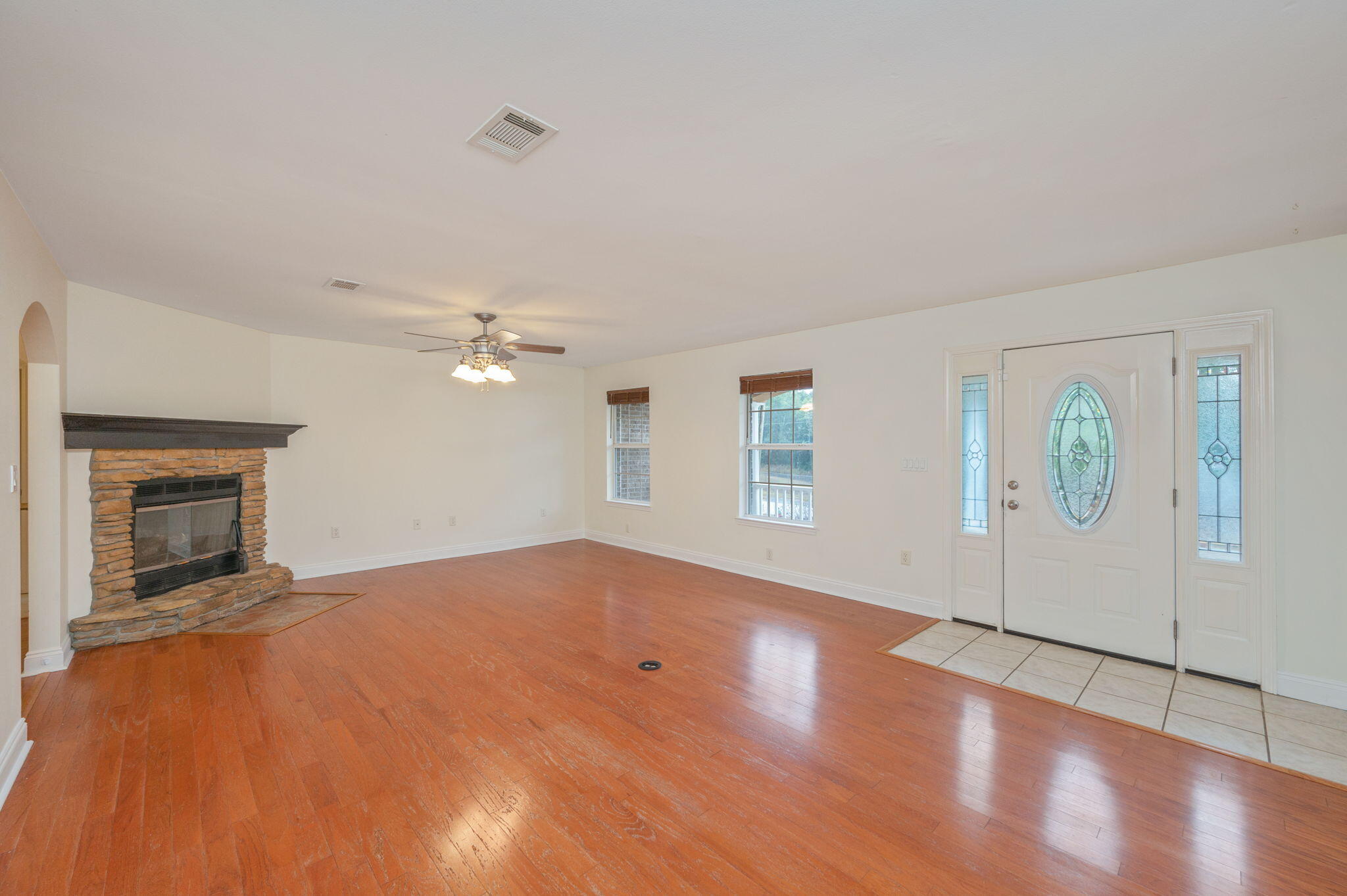 231 Seneca Trail Crestview, FL 32536 - Photo 5 of 39 an empty room with windows and fireplace