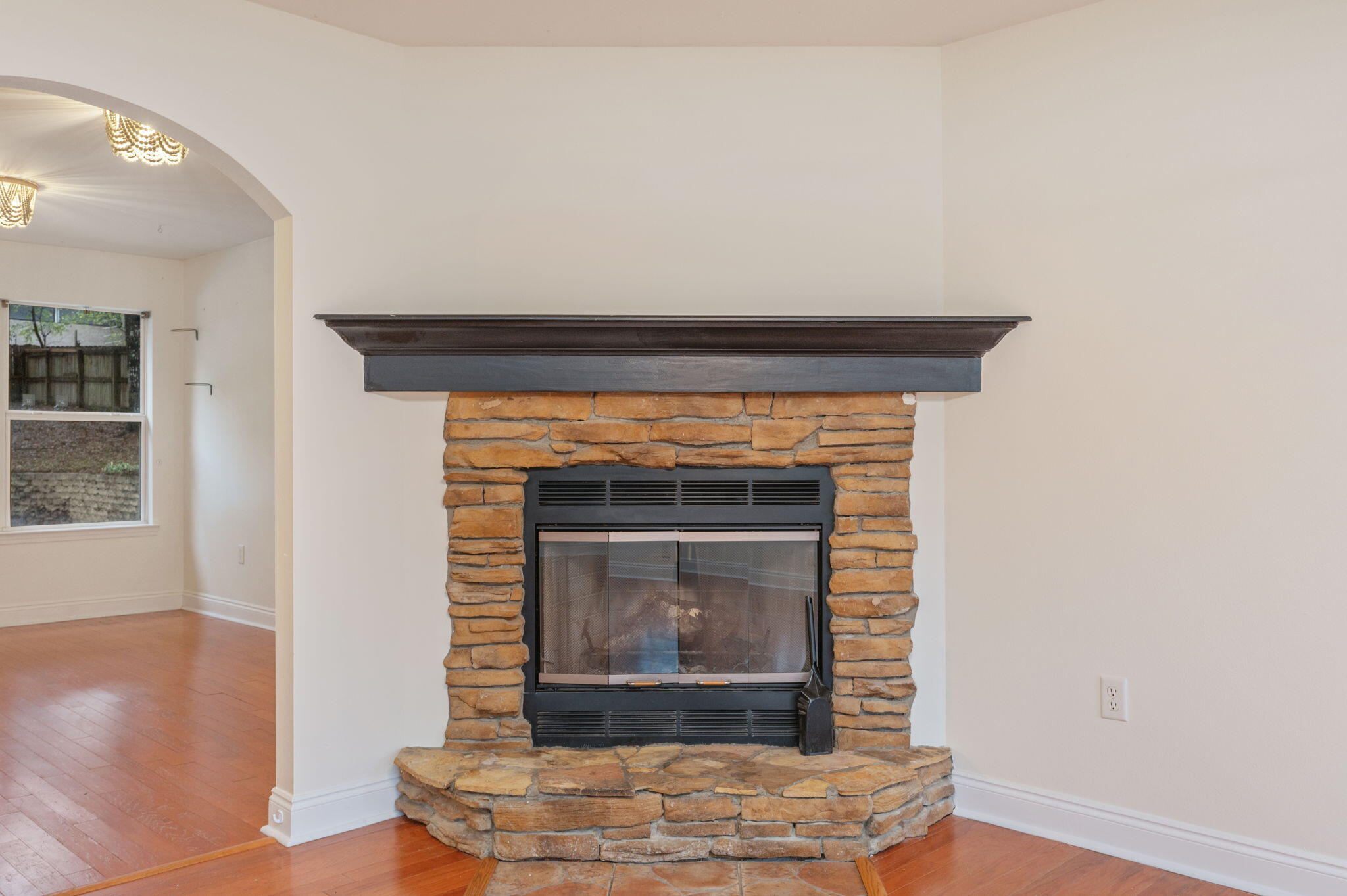 231 Seneca Trail Crestview, FL 32536 - Photo 7 of 39 a living room with fireplace and a wooden floor