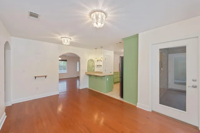a view of a room with cabinet and wooden floor