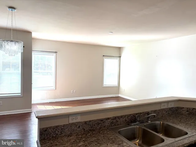 a kitchen with a sink and a window