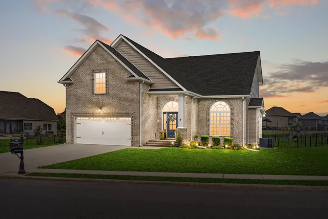 a front view of a house with a yard