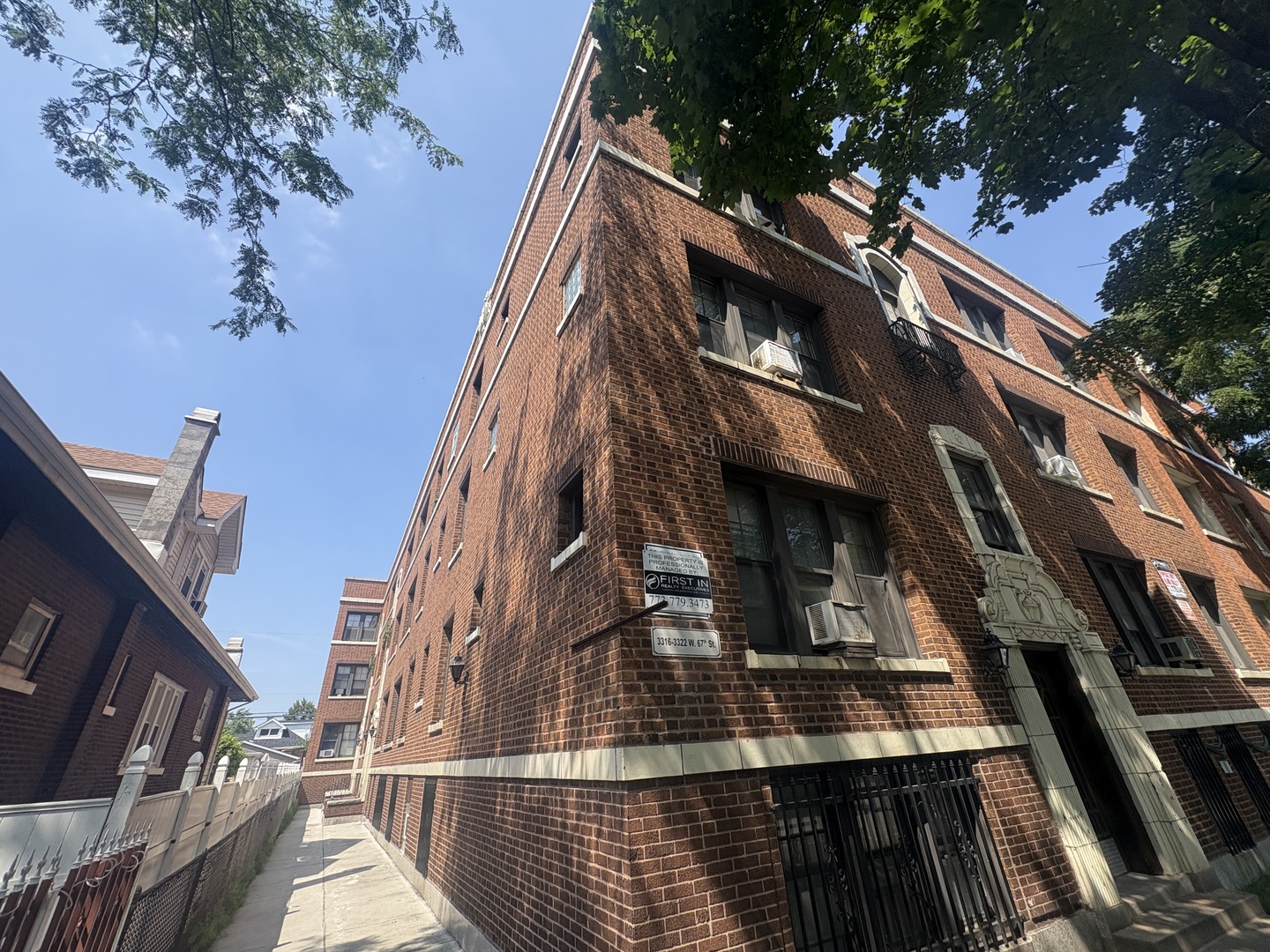 3316 West 67th Street, Unit GARDEN Chicago, IL 60629 - Photo 2 of 5 a view of a building with a tree