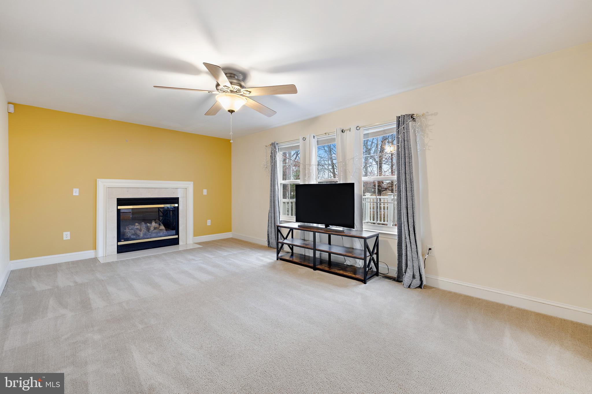 8008 Carlean Court Pasadena, MD 21122 - Photo 11 of 35 a living room with furniture and a flat screen tv
