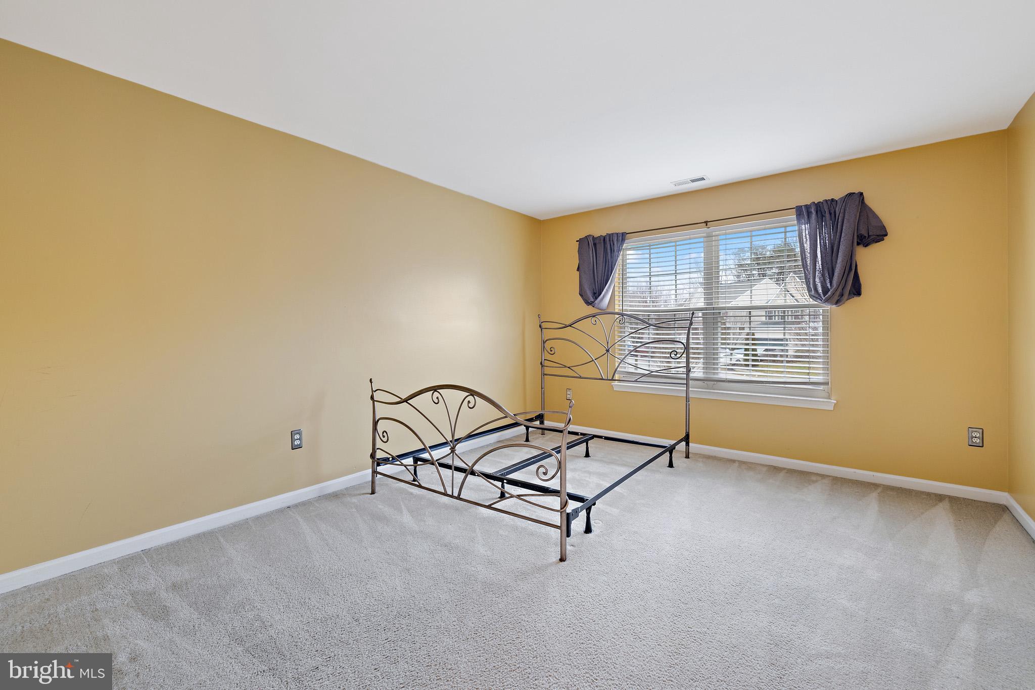 8008 Carlean Court Pasadena, MD 21122 - Photo 22 of 35 an empty room with windows