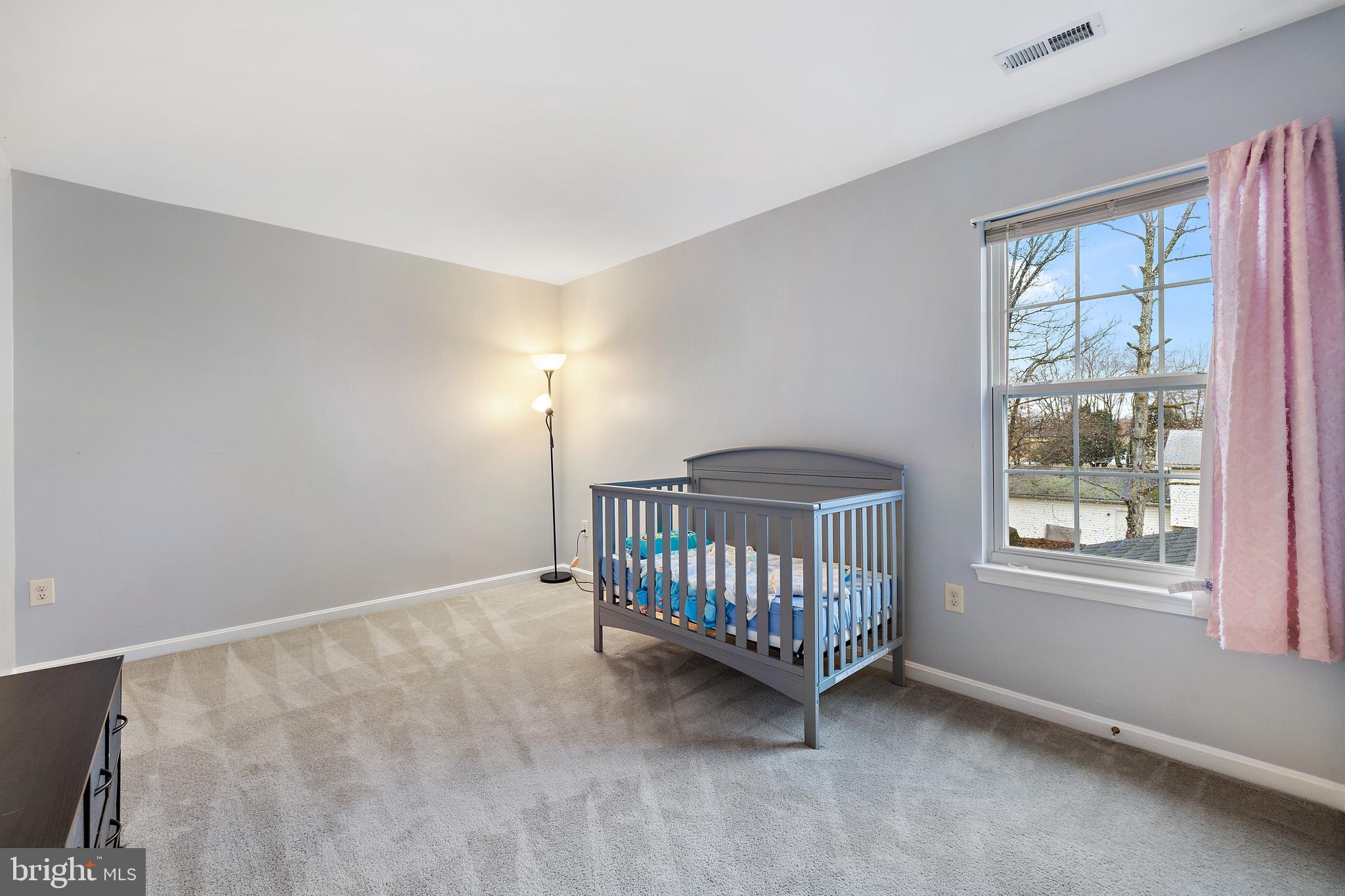 8008 Carlean Court Pasadena, MD 21122 - Photo 25 of 35 a view of a room with windows & cabinet bathroom