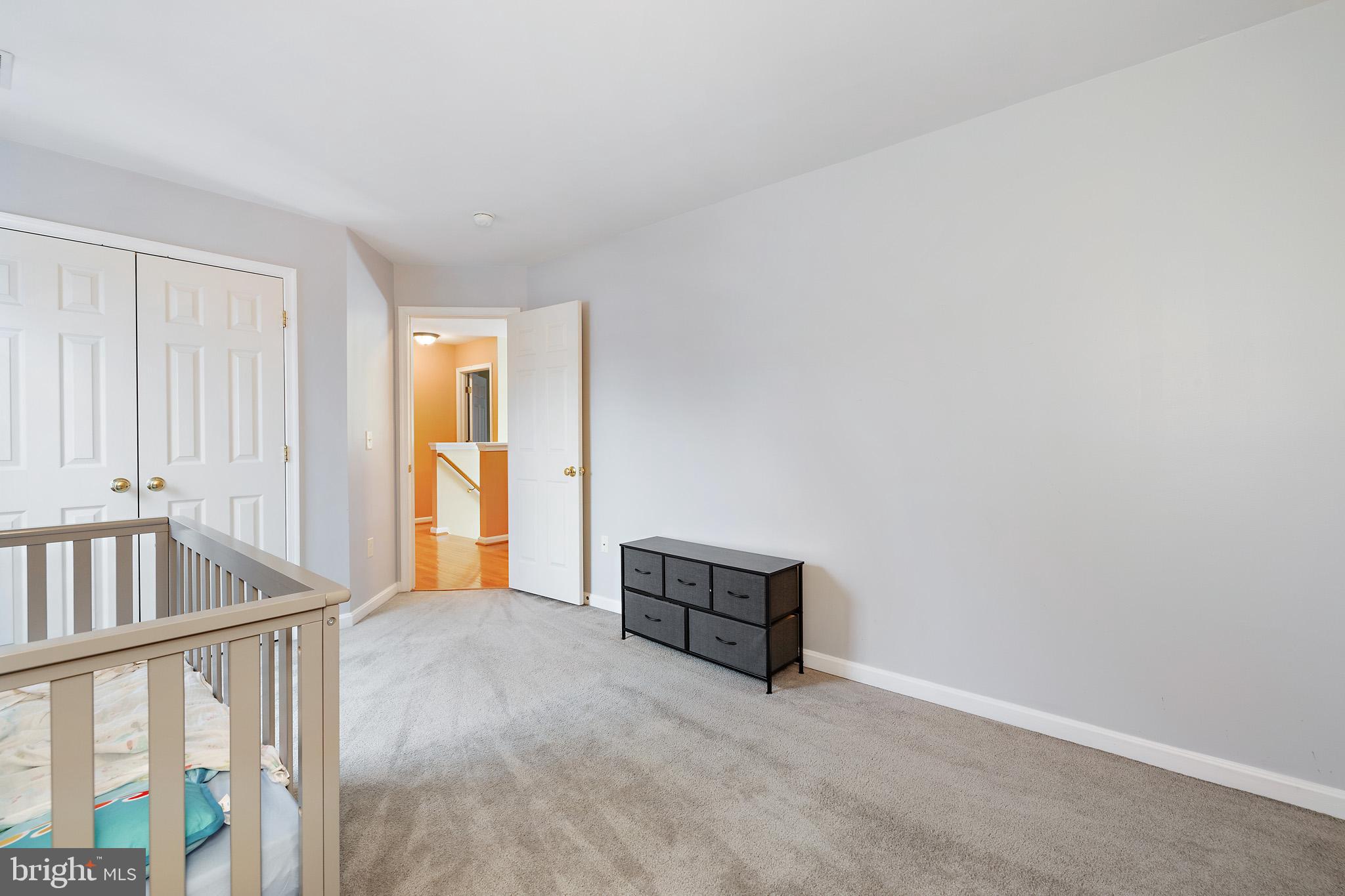 8008 Carlean Court Pasadena, MD 21122 - Photo 26 of 35 wooden floor in an empty room with a window