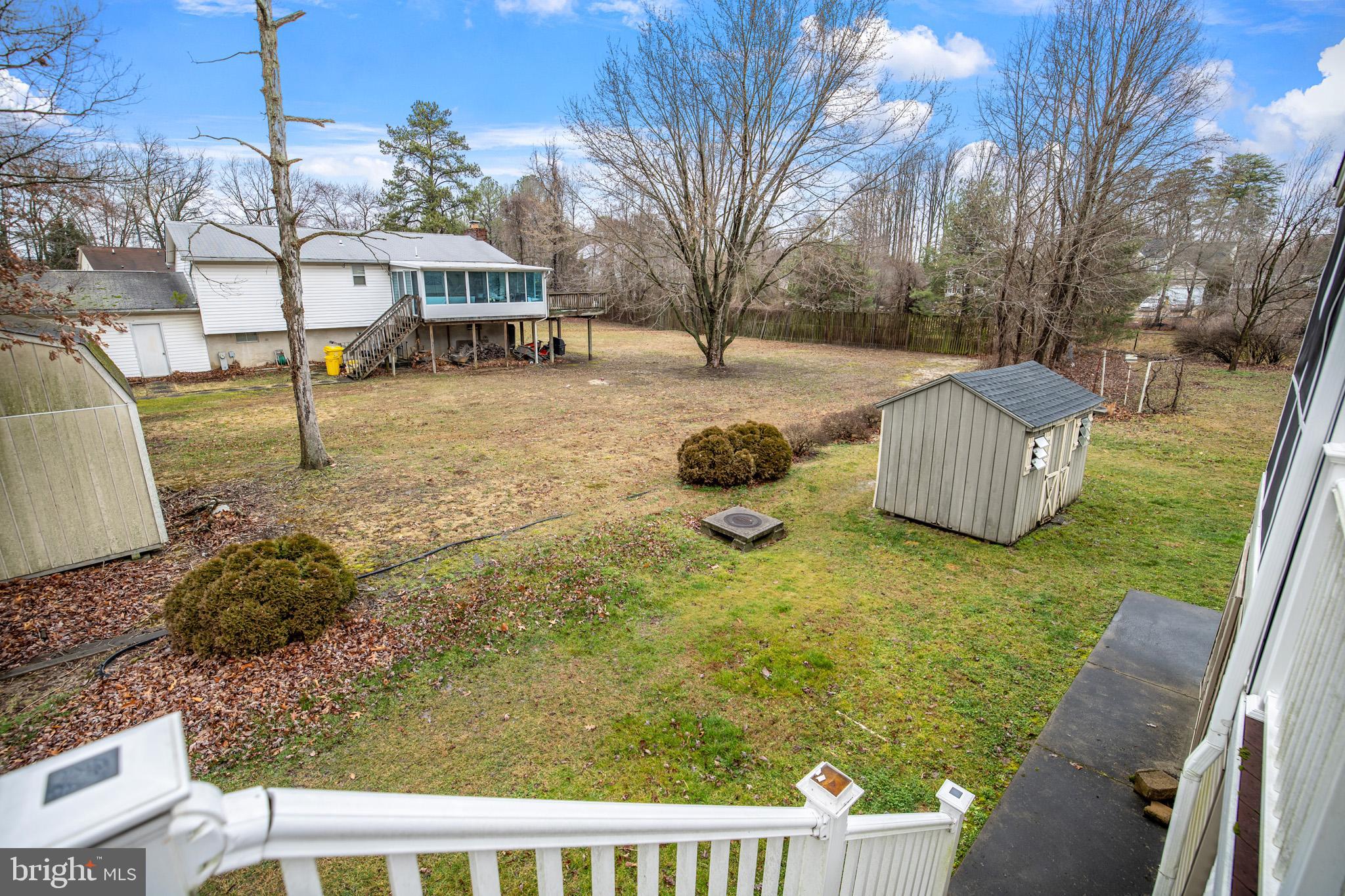 8008 Carlean Court Pasadena, MD 21122 - Photo 33 of 35 a view of a chairs and fire pit in the backyard