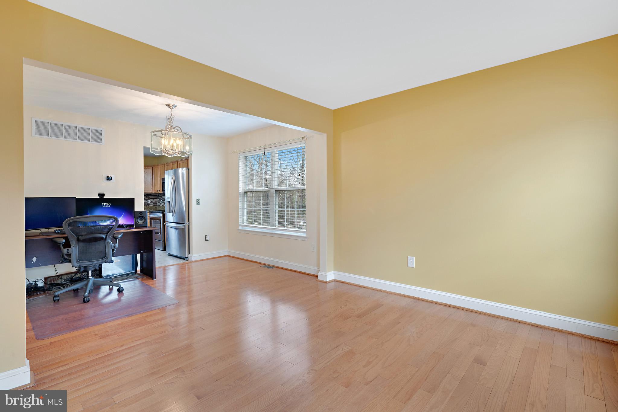 8008 Carlean Court Pasadena, MD 21122 - Photo 4 of 35 a view of a room with workspace and a window