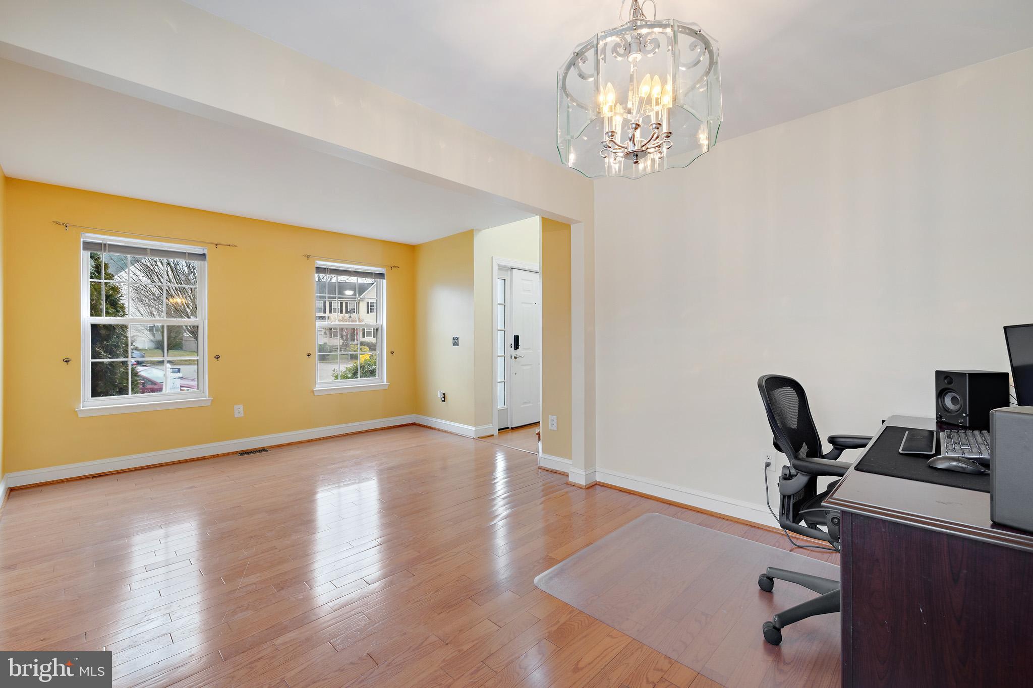 8008 Carlean Court Pasadena, MD 21122 - Photo 5 of 35 a view of workspace with wooden floor windows