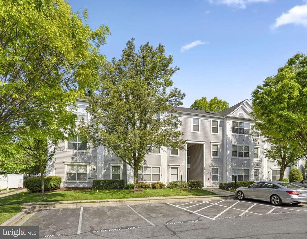 14200 Valleyfield Drive, Unit 437 Silver Spring, MD 20906 - Photo 1 of 17 a front view of a building with garden