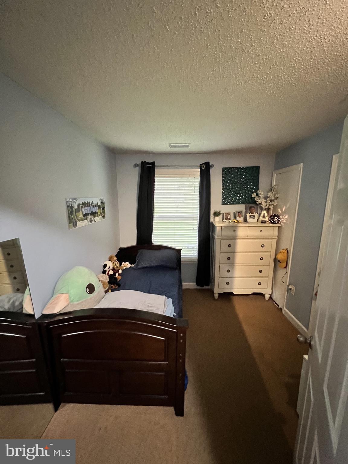 14200 Valleyfield Drive, Unit 437 Silver Spring, MD 20906 - Photo 12 of 17 a bedroom with bed and window
