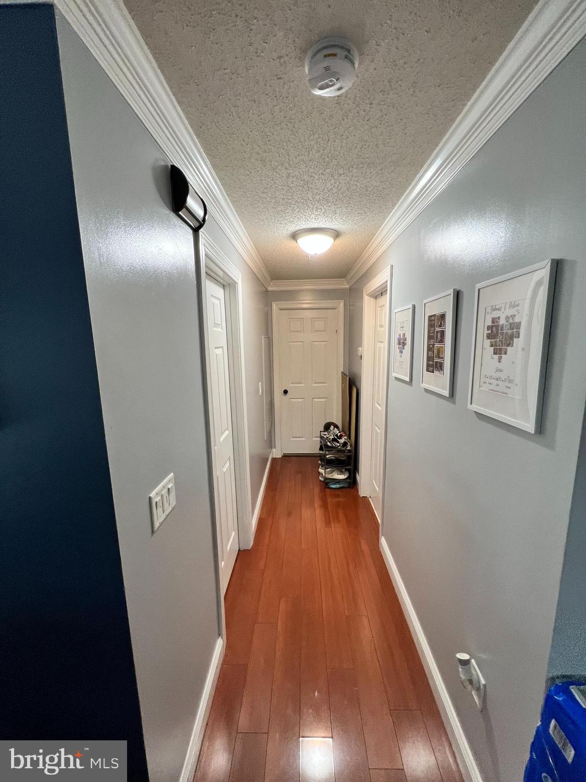 14200 Valleyfield Drive, Unit 437 Silver Spring, MD 20906 - Photo 14 of 17 a view of a hallway to a livingroom with furniture