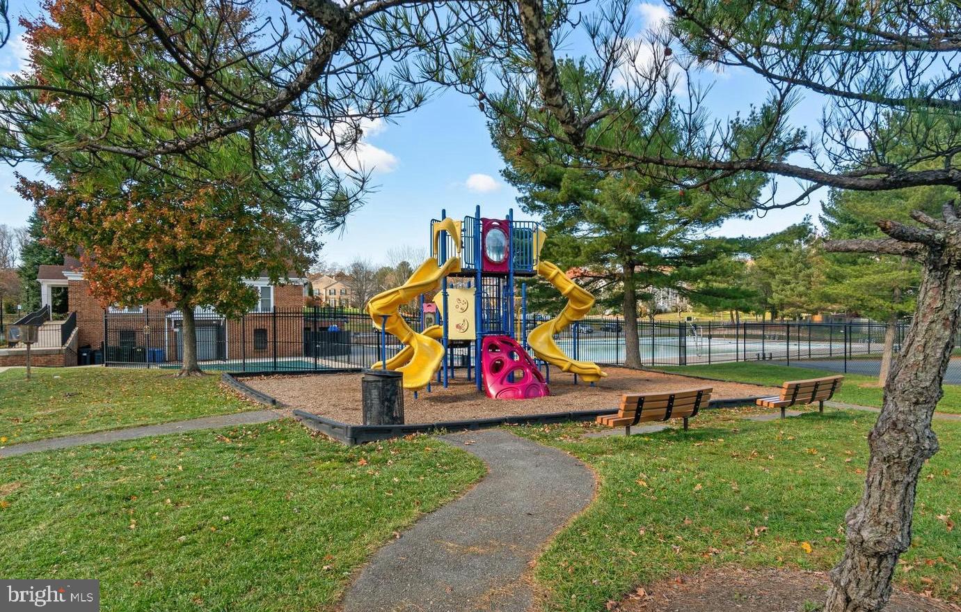 14200 Valleyfield Drive, Unit 437 Silver Spring, MD 20906 - Photo 16 of 17 a childrens park with lots of swings and slides