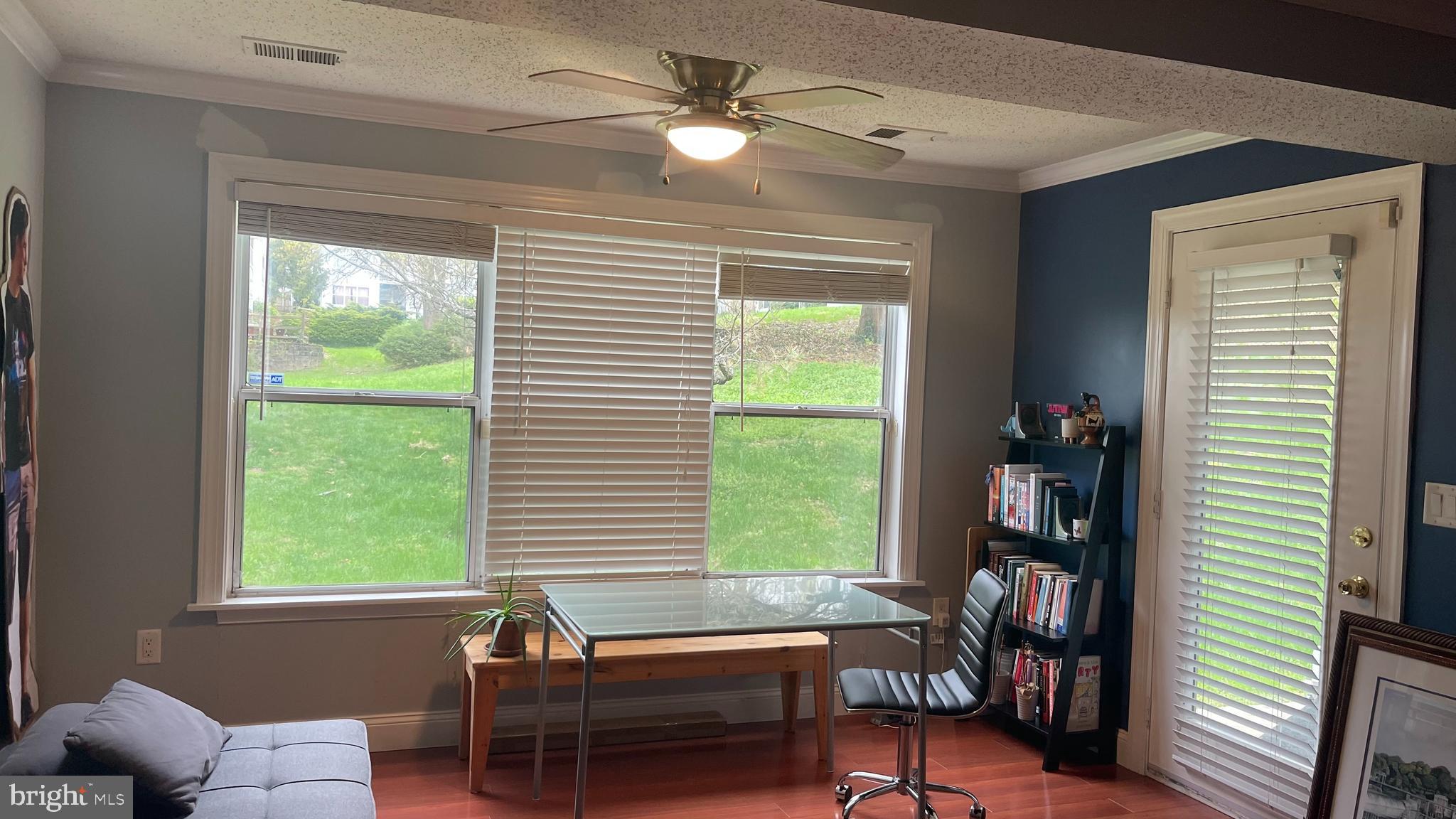 14200 Valleyfield Drive, Unit 437 Silver Spring, MD 20906 - Photo 2 of 17 a living room with furniture and a window