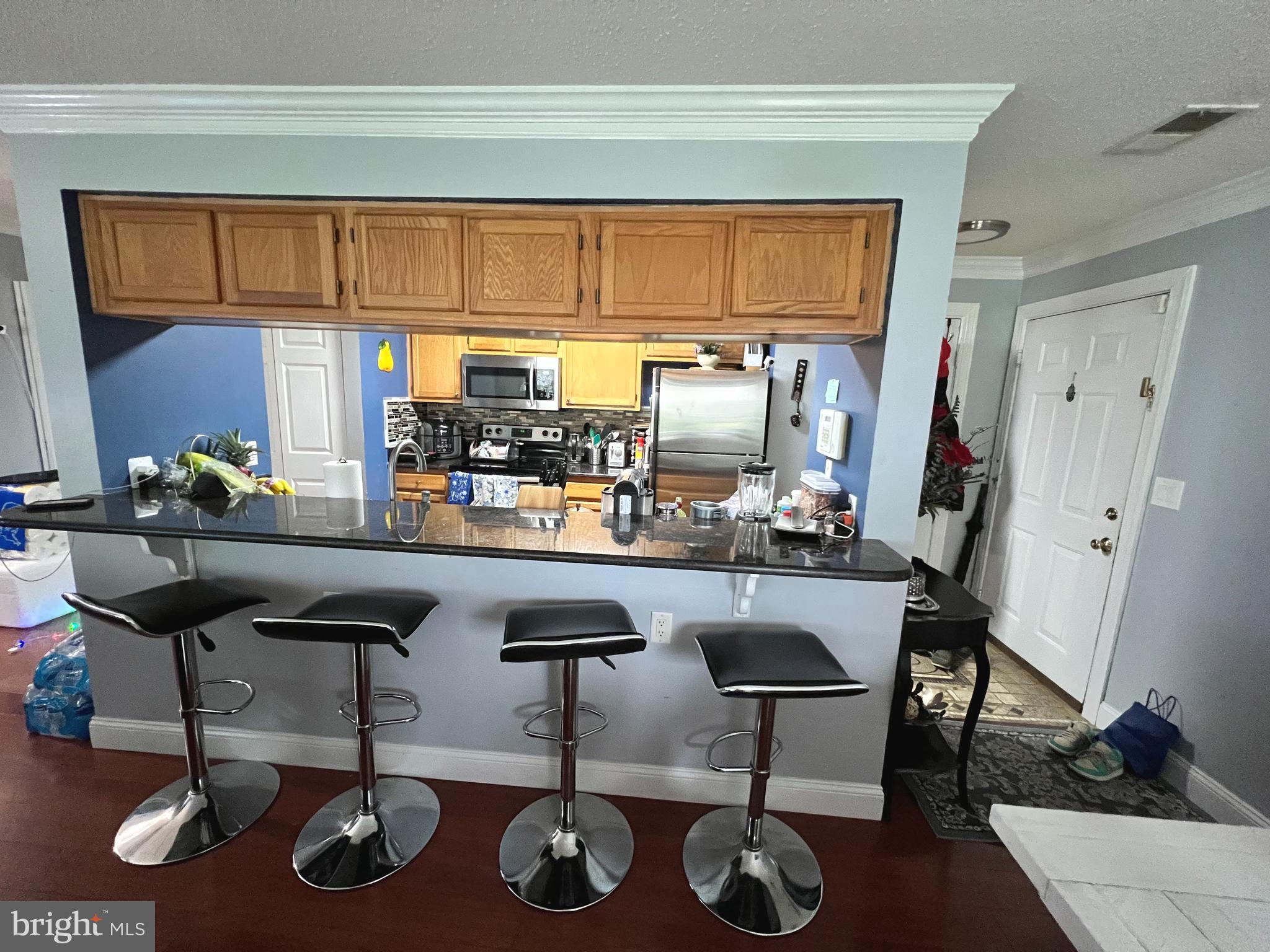 14200 Valleyfield Drive, Unit 437 Silver Spring, MD 20906 - Photo 5 of 17 a room with musical instruments