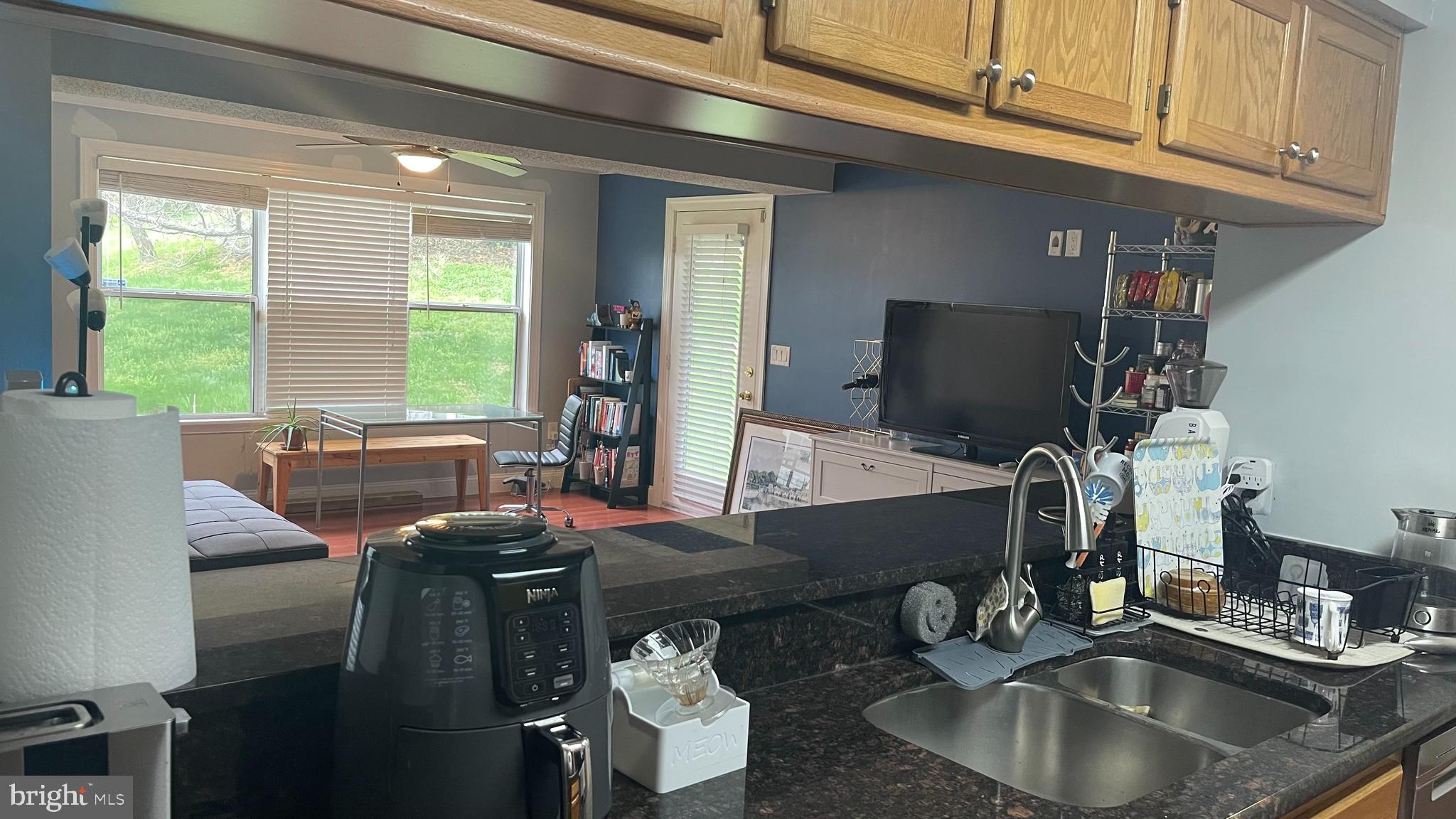 14200 Valleyfield Drive, Unit 437 Silver Spring, MD 20906 - Photo 6 of 17 a room with furniture and a large window