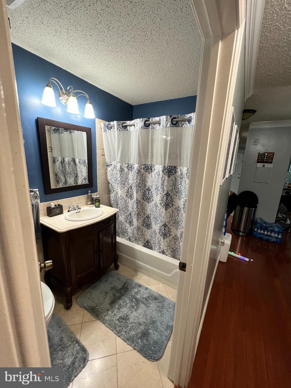 14200 Valleyfield Drive, Unit 437 Silver Spring, MD 20906 - Photo 10 of 17 a bathroom with a sink double vanity and a mirror