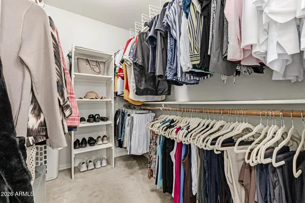a bathroom with a granite countertop sink toilet a mirror and shower