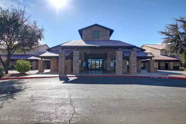 a view of swimming pool with outdoor seating and palm tree