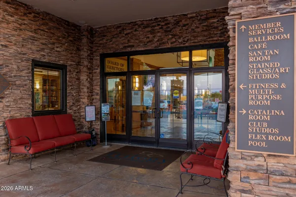 a view of a patio with a table and chairs