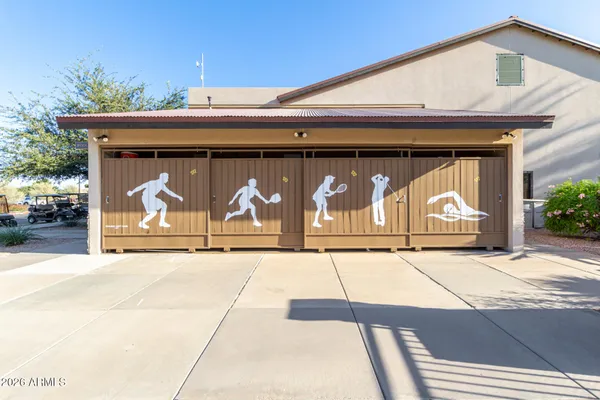 a living room with lots of furniture and a large window