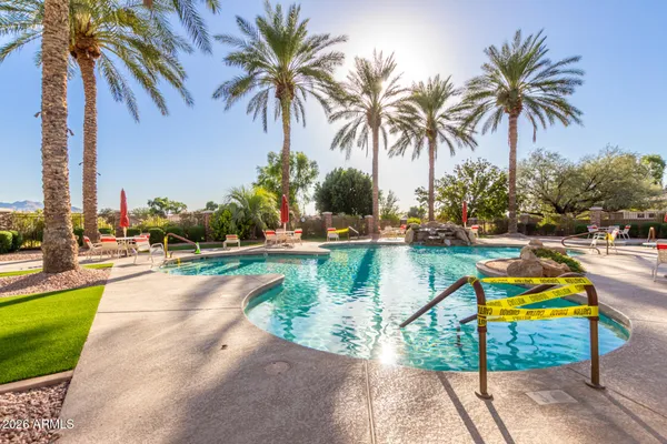 a living room with furniture and a book shelf