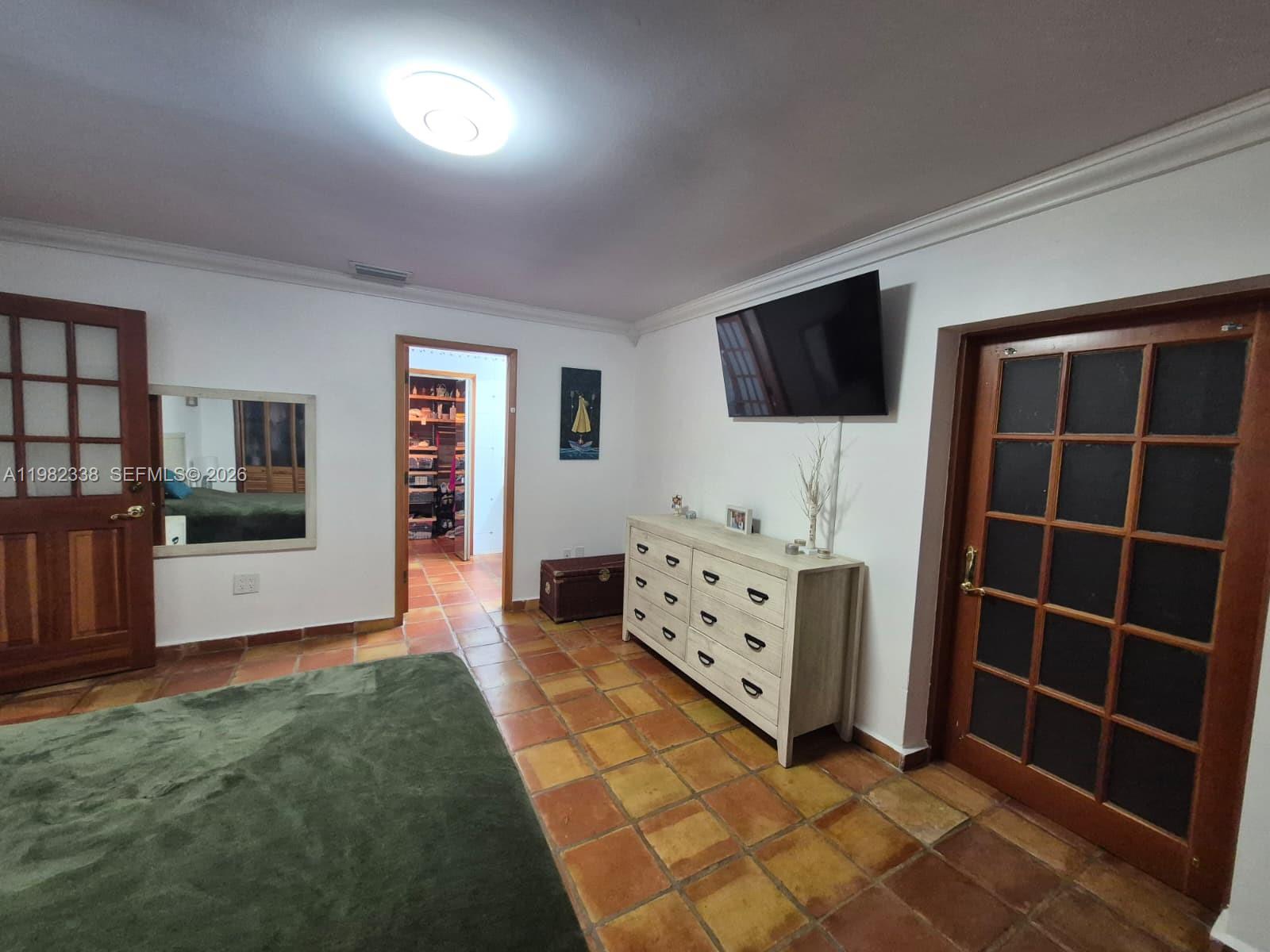 14530 Southwest 110th Street Miami, FL 33186 - Photo 16 of 45 a living room with furniture and a flat screen tv