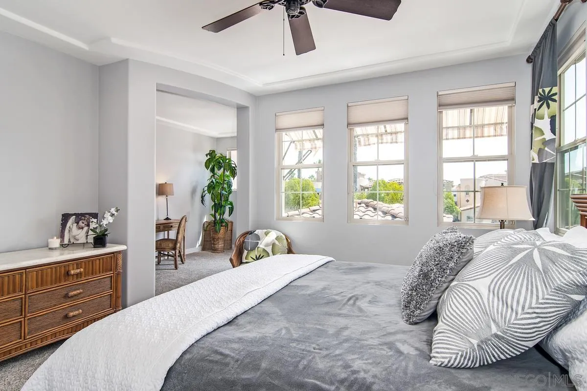 2080 Historic Decatur Road San Diego, CA 92106 - Photo 22 of 47 a bedroom with a bed and window