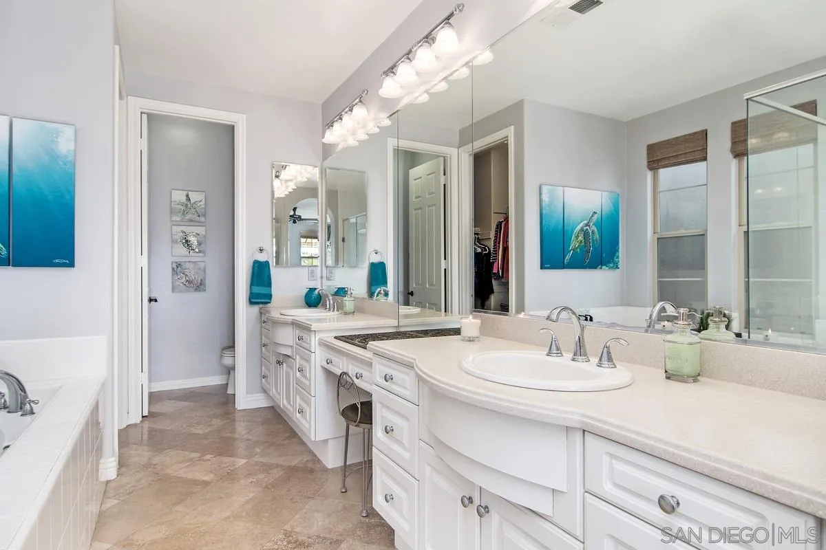 2080 Historic Decatur Road San Diego, CA 92106 - Photo 23 of 47 a spacious bathroom with a double vanity sink mirror and double