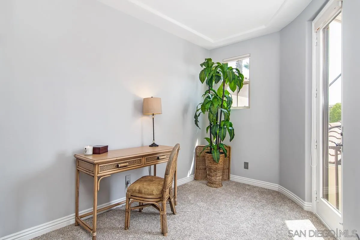2080 Historic Decatur Road San Diego, CA 92106 - Photo 24 of 47 a room with furniture and a potted plant